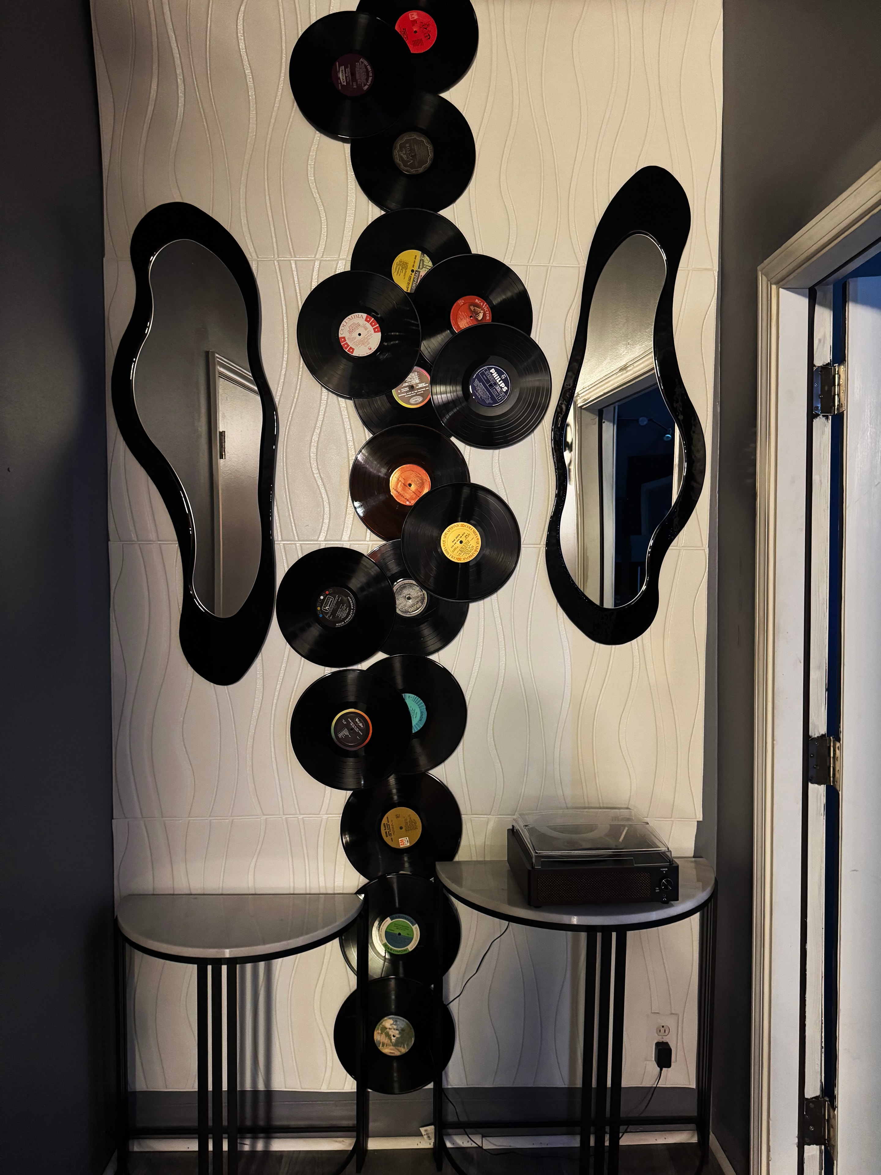 Lobby vinyl art — stacked vinyl record sculpture & turntable display