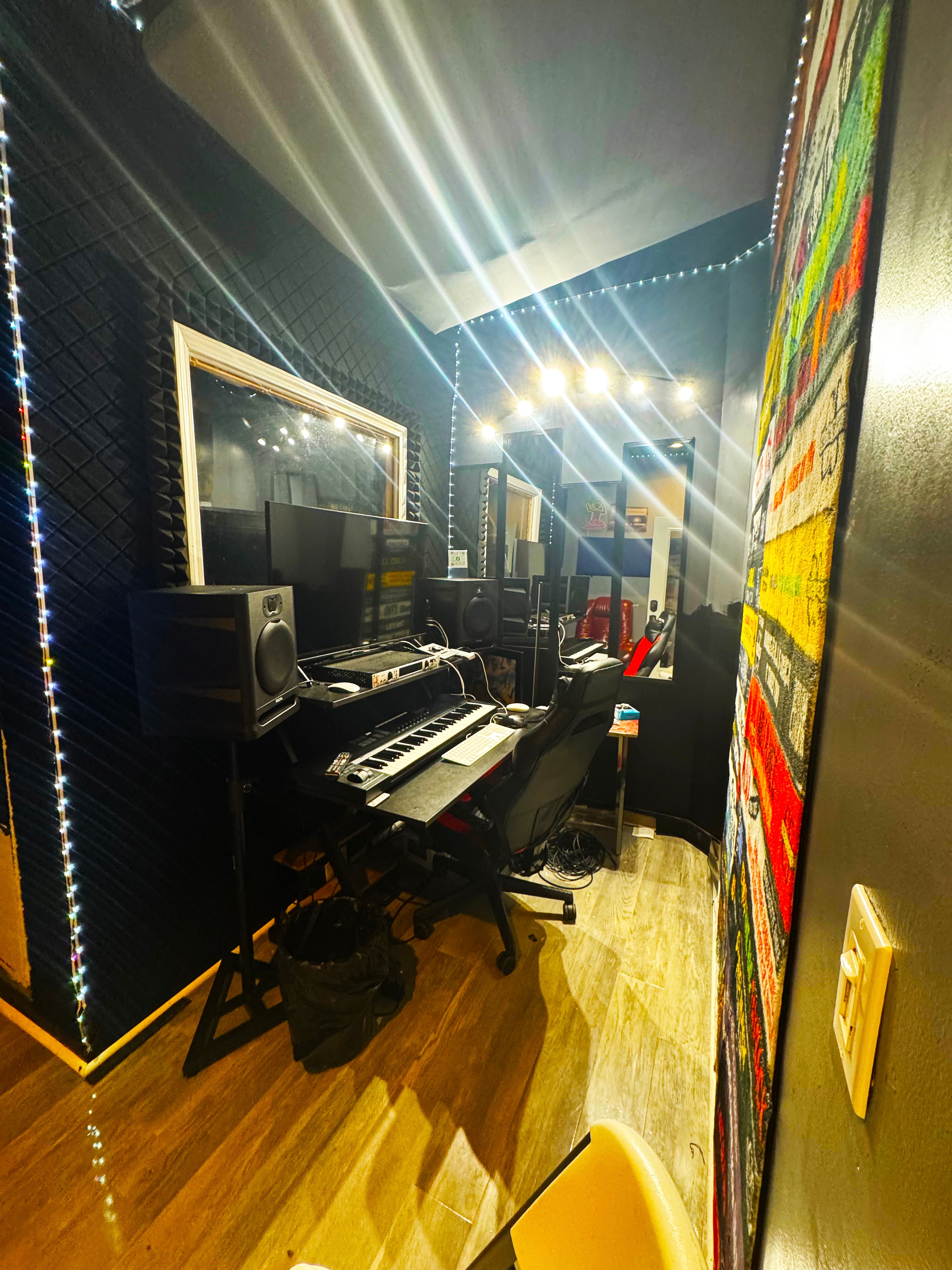 Studio B acoustic panels, monitor speakers & hip-hop wall art