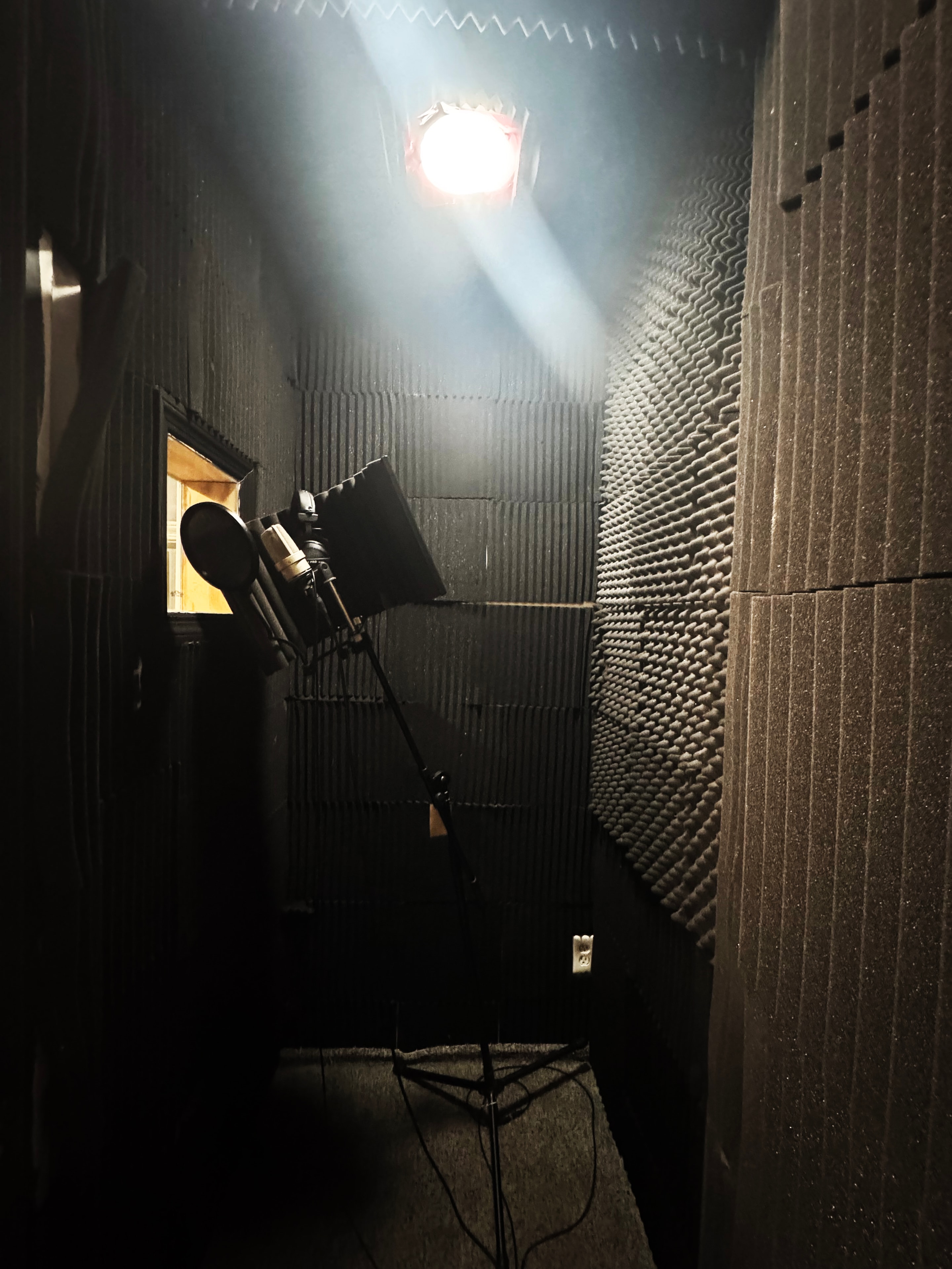 Vocal Booth A — fully treated isolation booth with condenser mic
